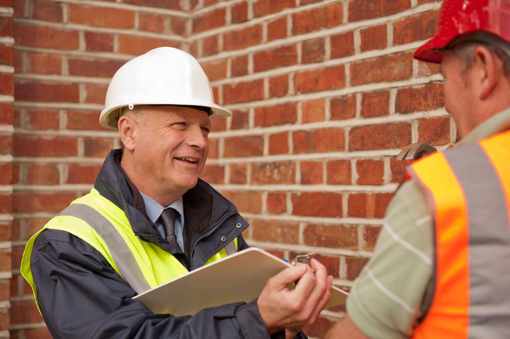 Site Manager discussing project with a construction worker